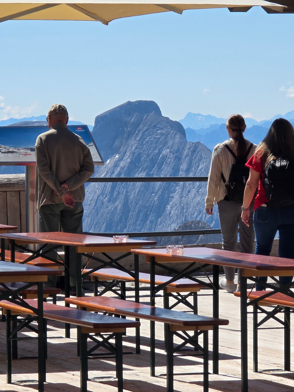 Sunny morning on a Bavarian Alps terrace with dogs and views