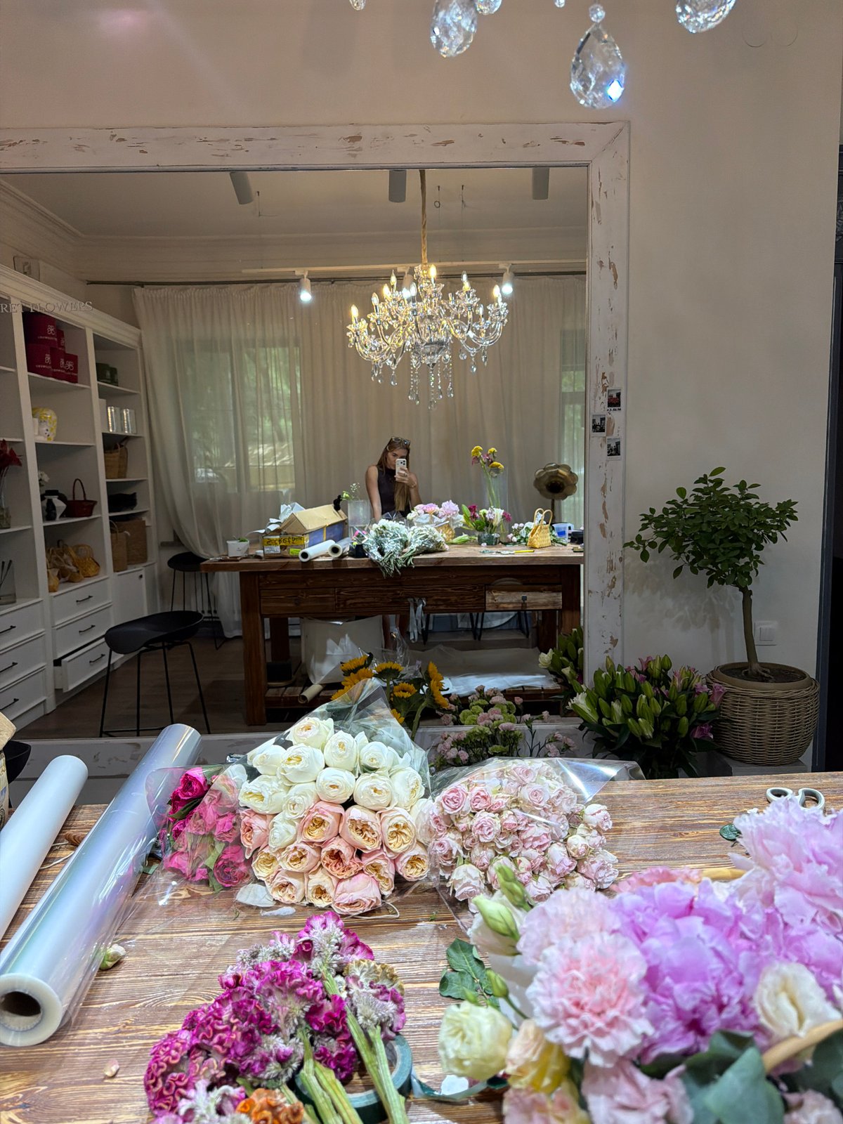 Inside a Bishkek flower shop during a busy morning of arranging