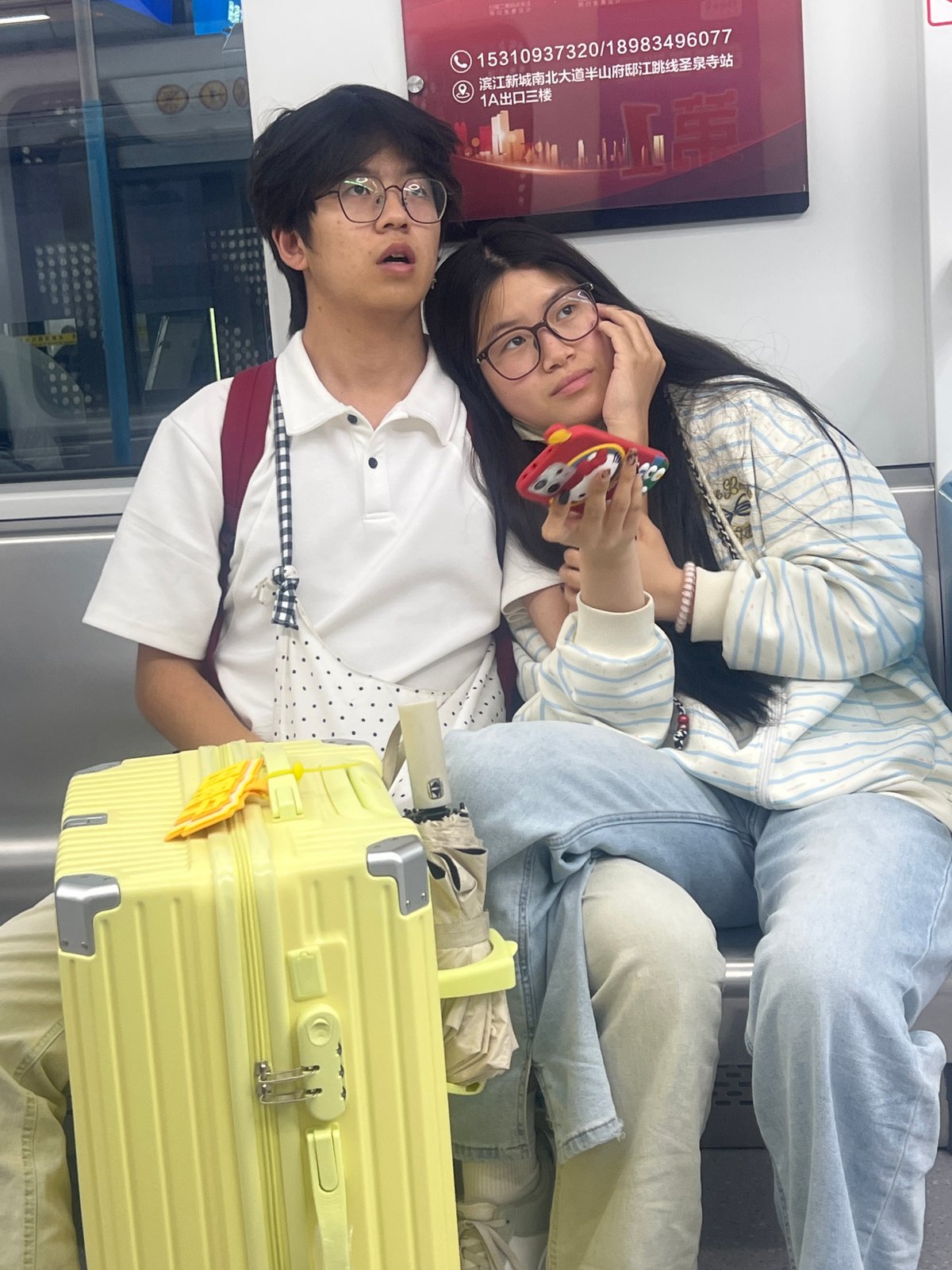Family rests during transit journey in Tiaodeng, China