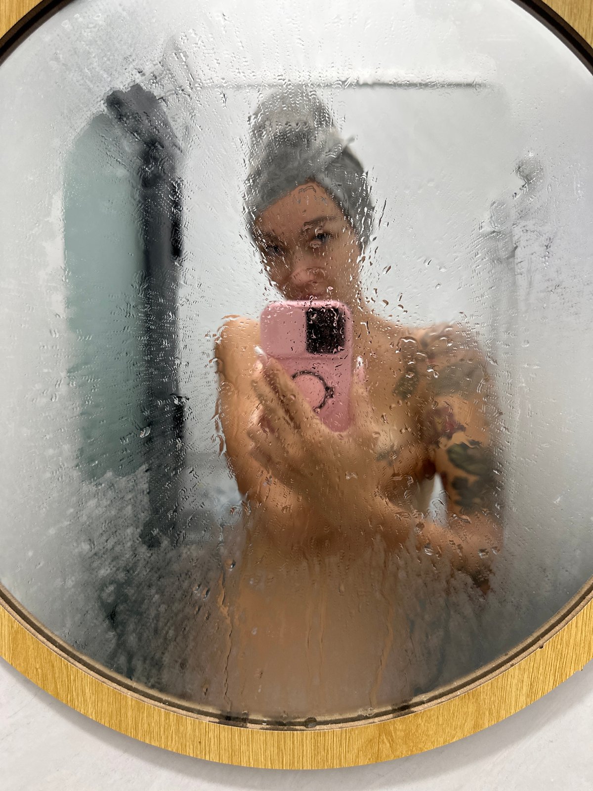 Early morning bathroom selfies captured through fogged mirror in Vietnam