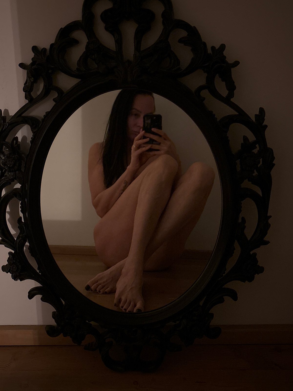 Individual observed in ornate mirror in Chaikovsky, Russia