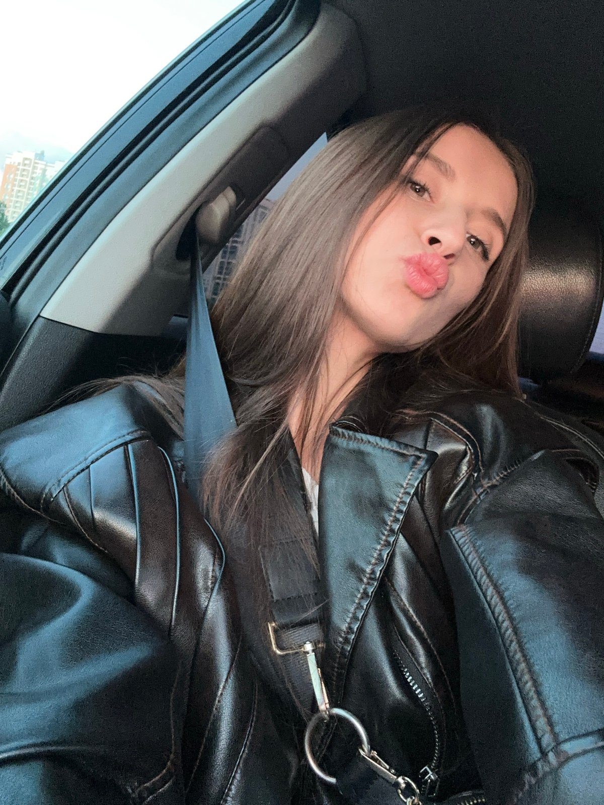 Woman takes selfie in car in Yekaterinburg