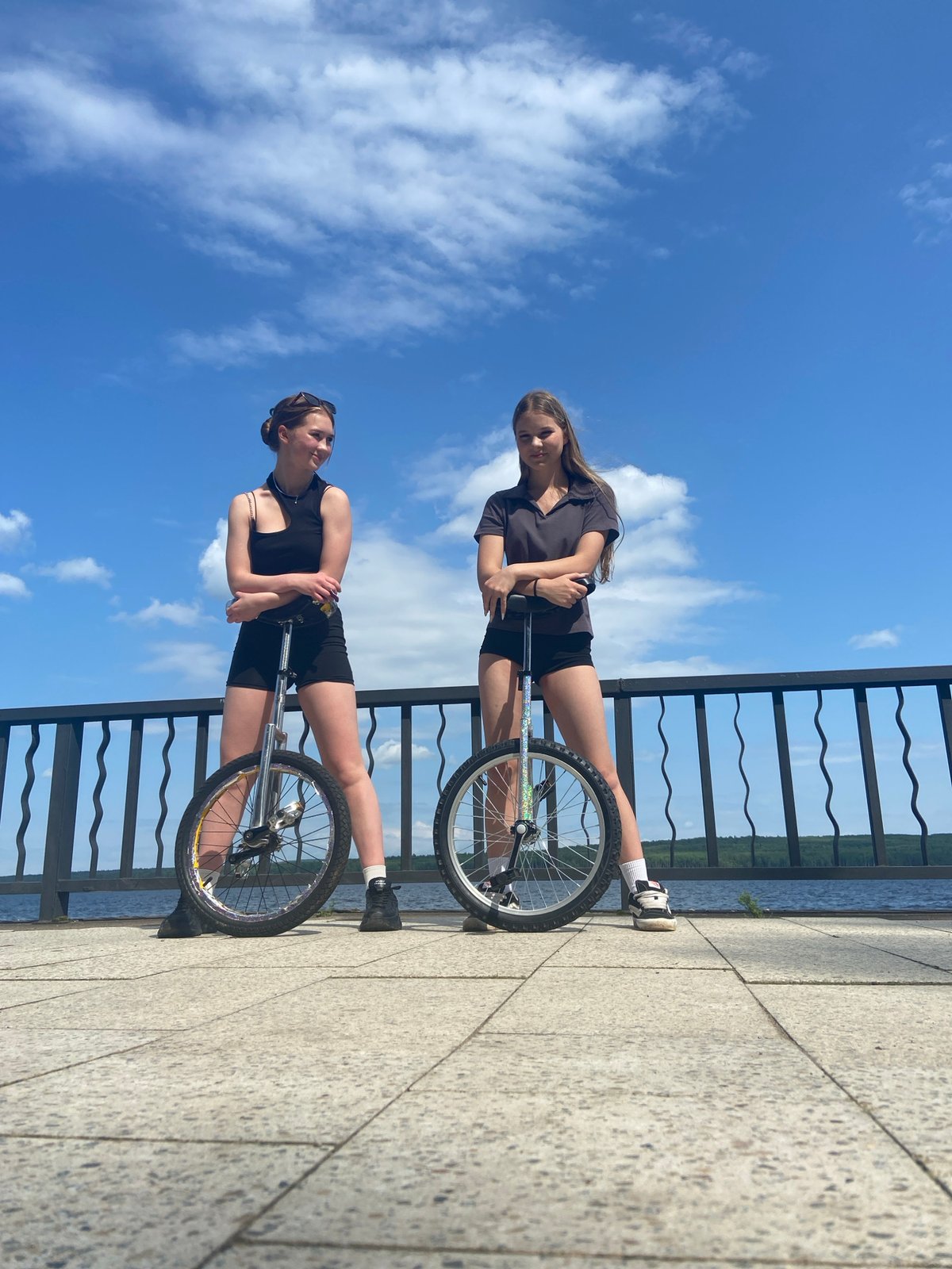 Unicycling along a riverside promenade in Chaikovsky, Russia