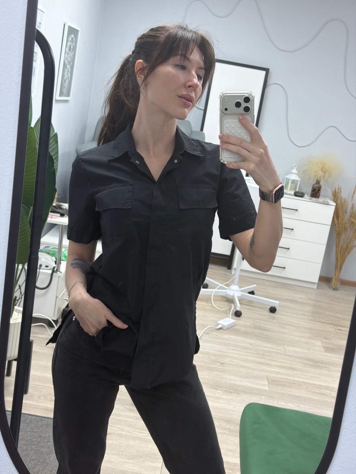 Woman takes selfies in mirror at Perm office