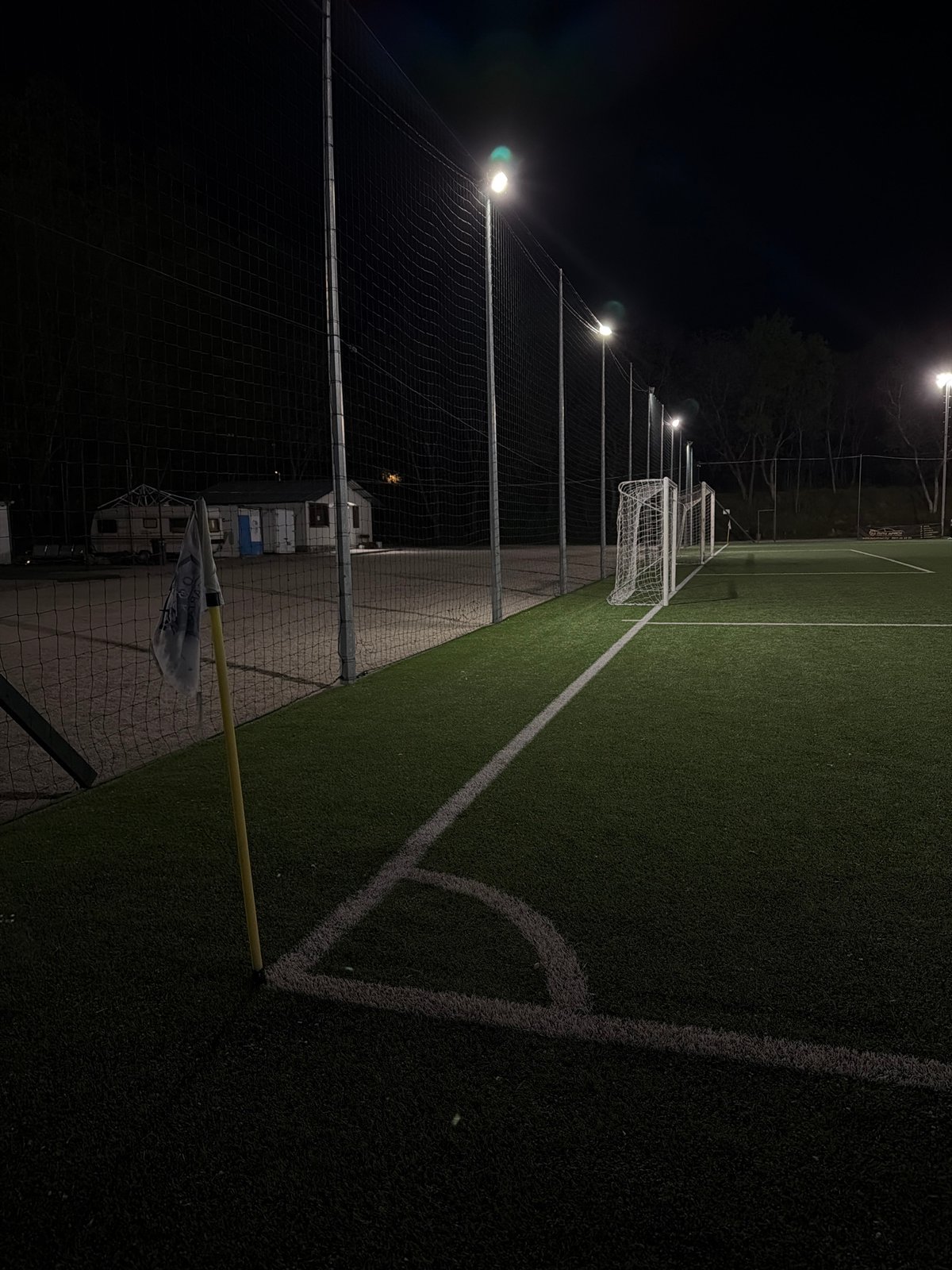 Empty soccer field illuminated at night in Pleven, Bulgaria