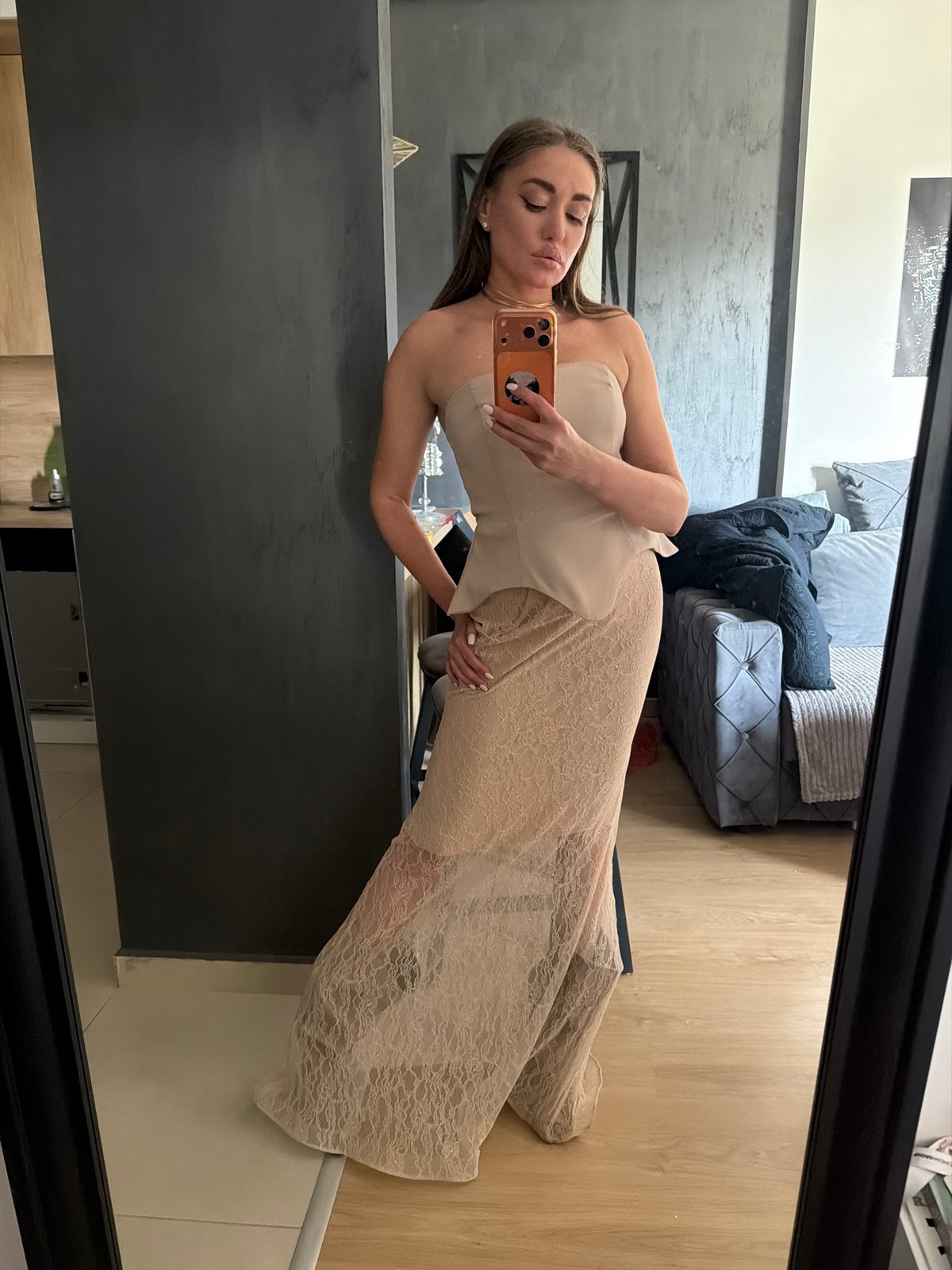 Woman takes mirror selfie in modern setting, Bar Montenegro