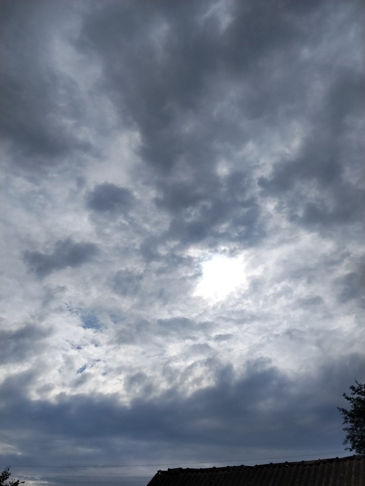 Heavy cloud cover rolls over Ustyvytsia on a stormy afternoon
