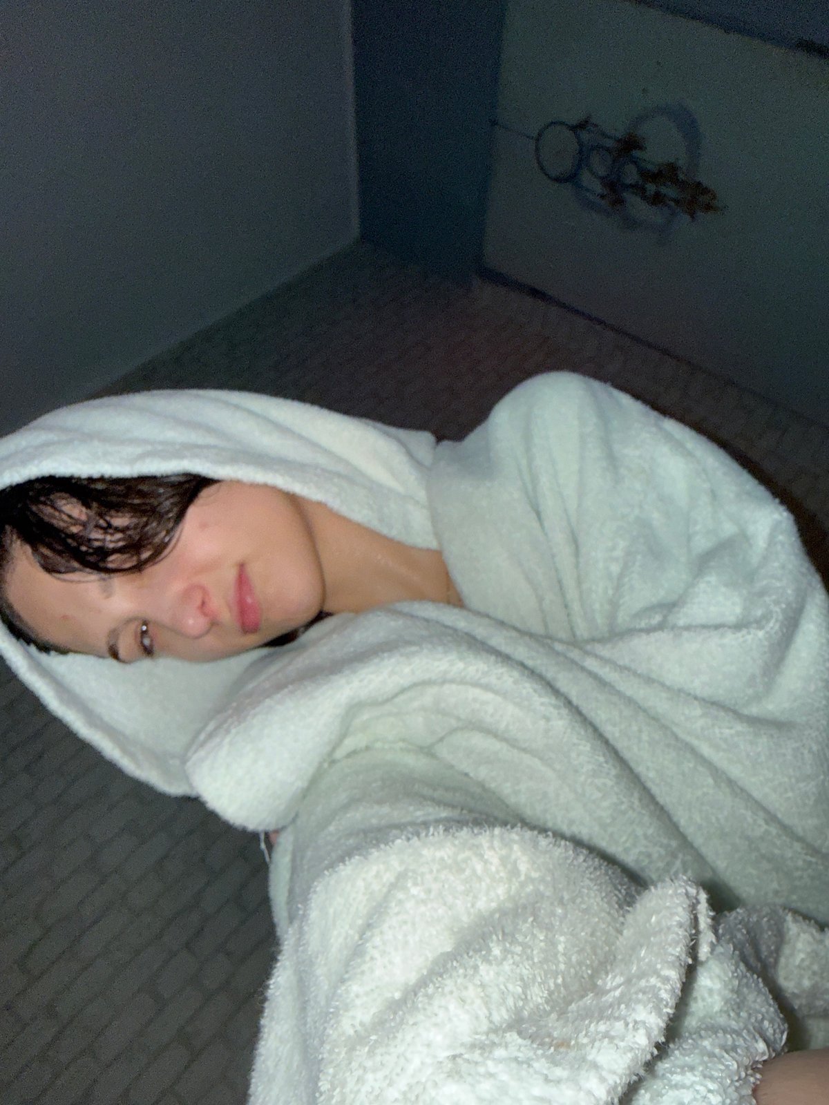 Woman in towel observed indoors in Sofia