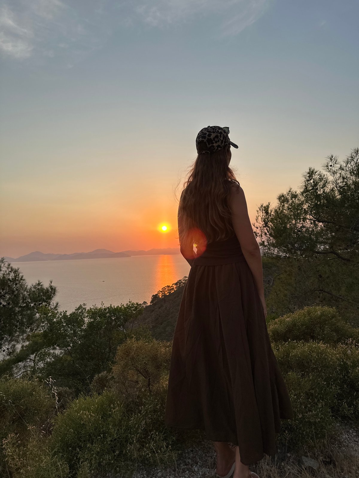 Tourist captures sunset views over Fethiye harbor from Turkish hillside