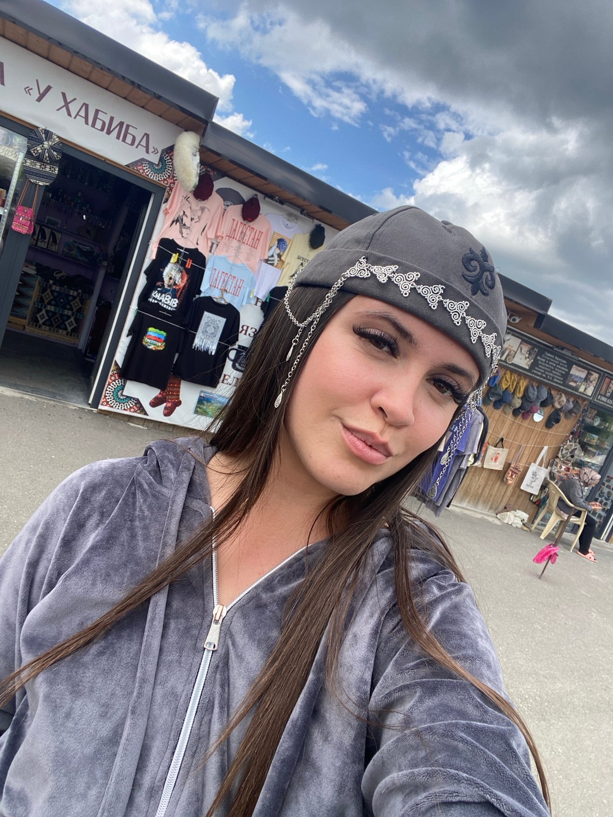 Selfies at an outdoor market in Tsalkita, Russia