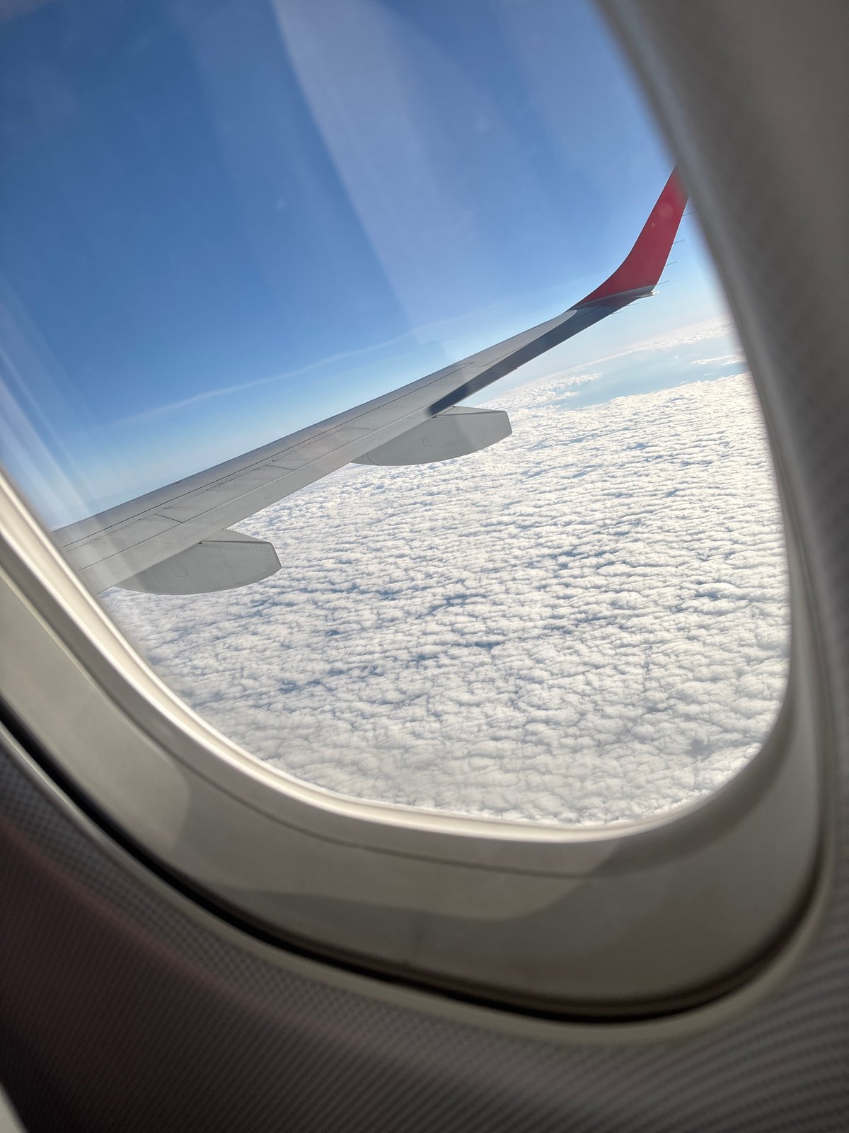 Passenger documents aerial views during morning flight over Austria