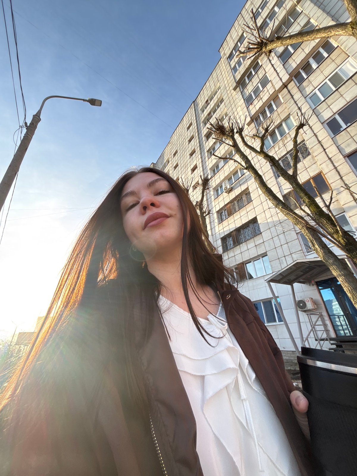 Woman photographed outdoors in Perm during early morning hours