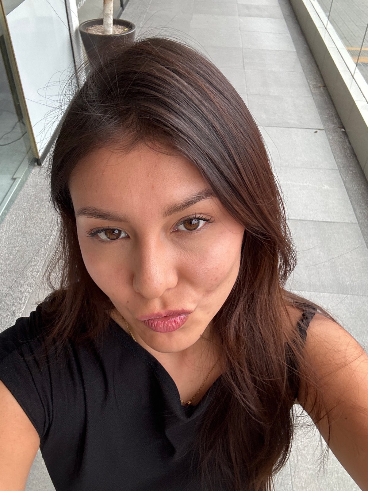 Woman takes selfie in San Bernardino Tlaxcalancingo, Mexico