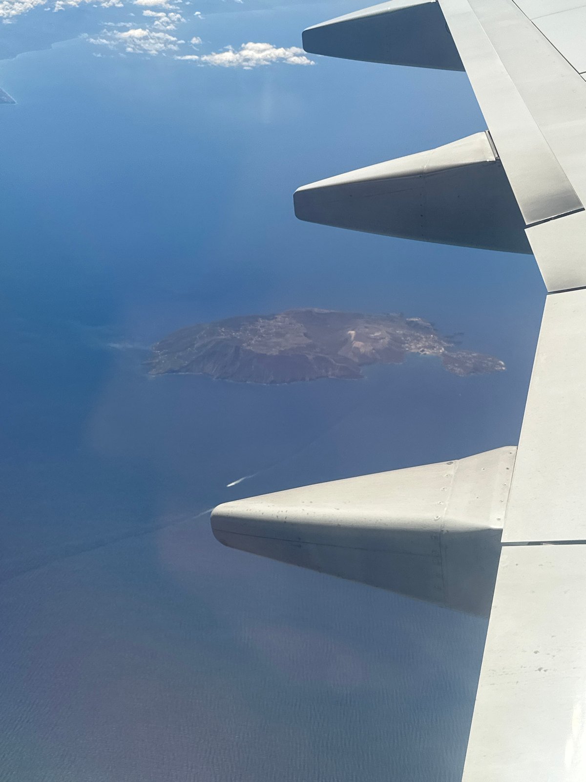Aerial view captures Italian island from airplane window