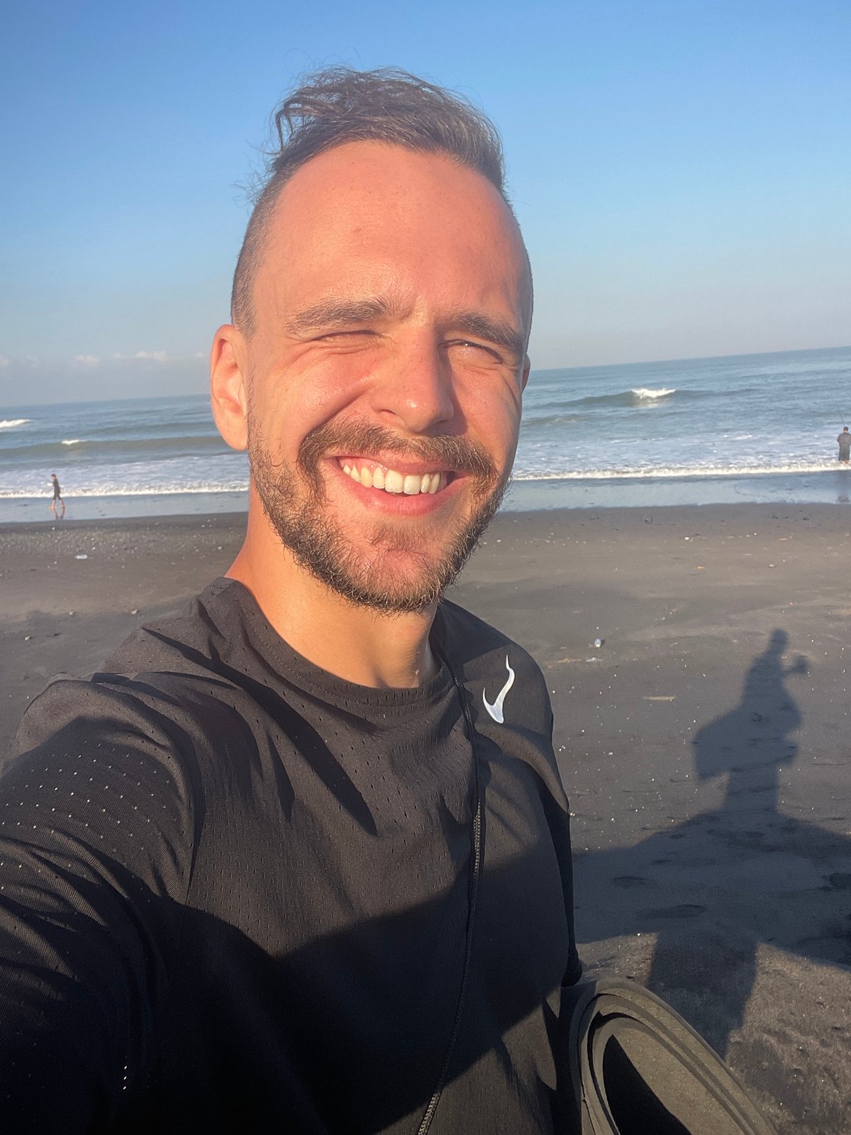 Student group visits Indonesian black sand beaches