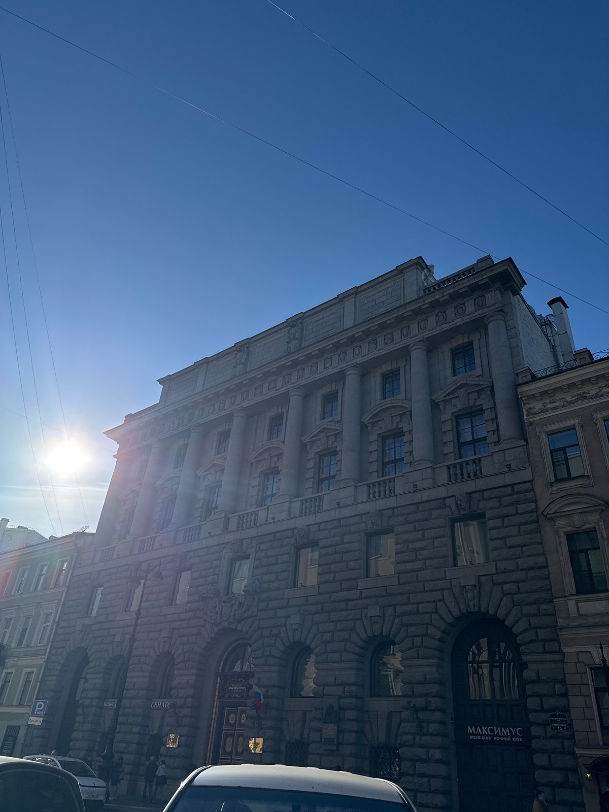 Tourists visit Saint Petersburg landmarks on sunny afternoon