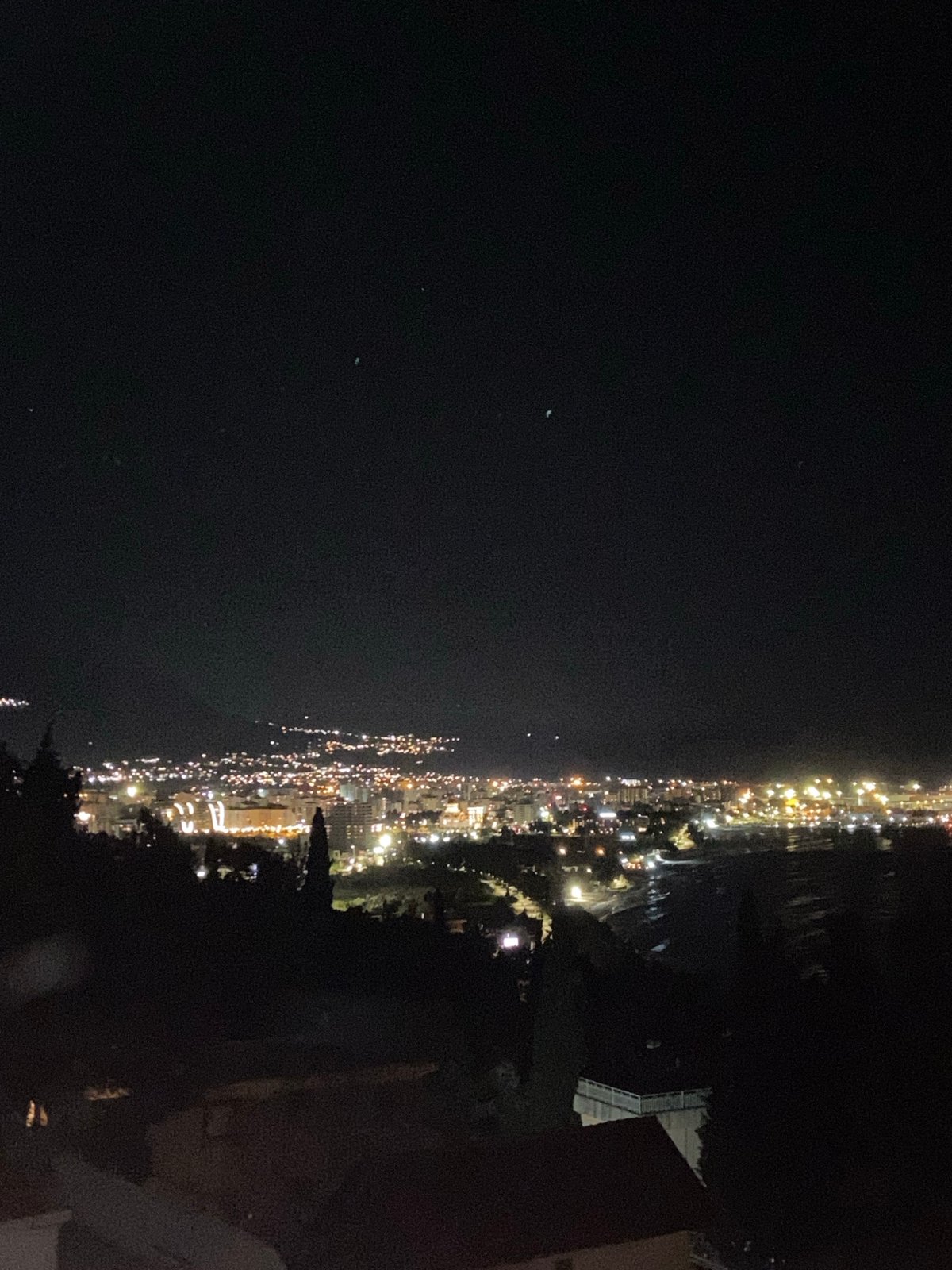 Nighttime photography session captures Šušanj cityscape and selfie portrait