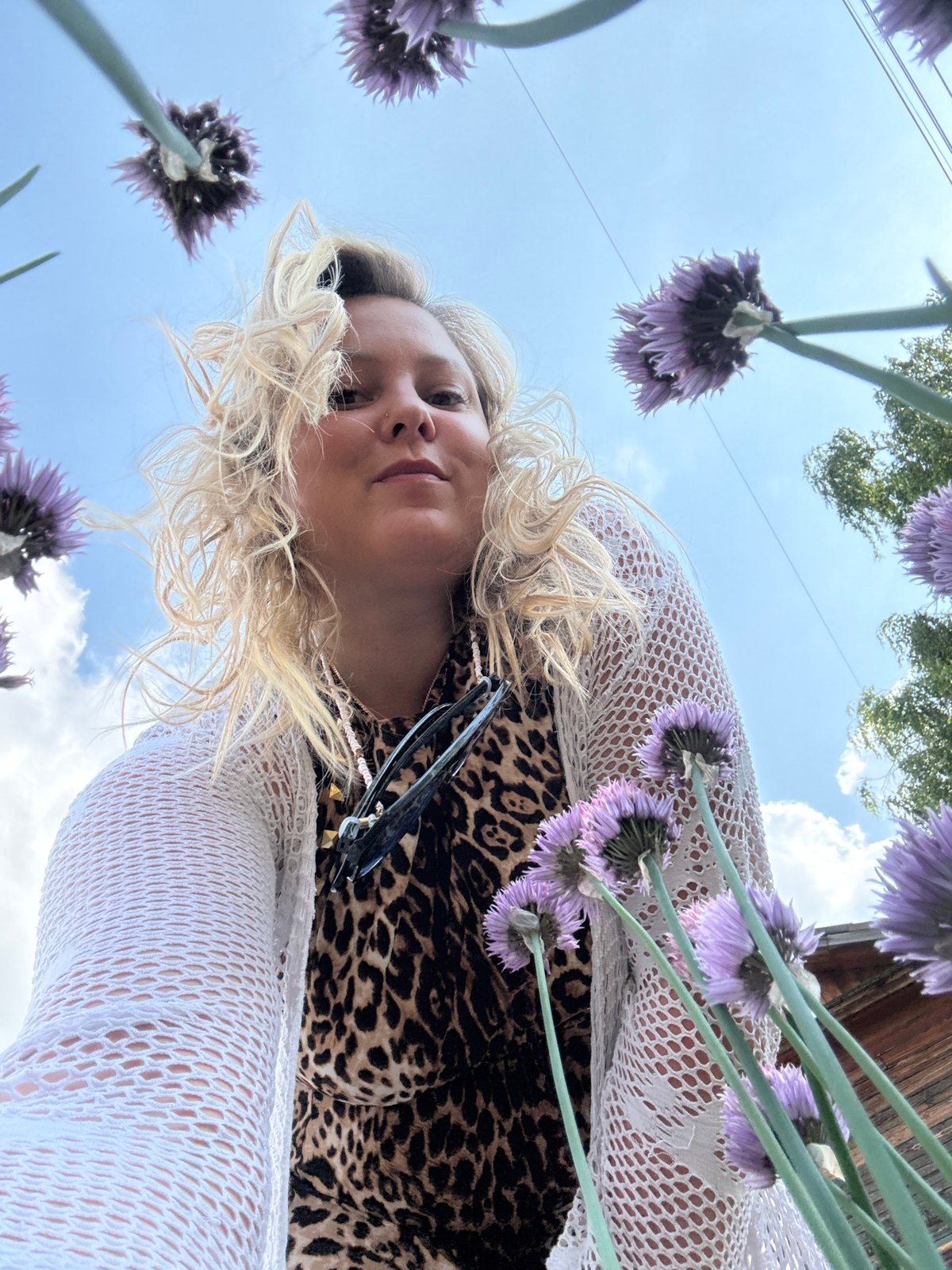 Garden photography session among flowers in Chaikovsky, Russia