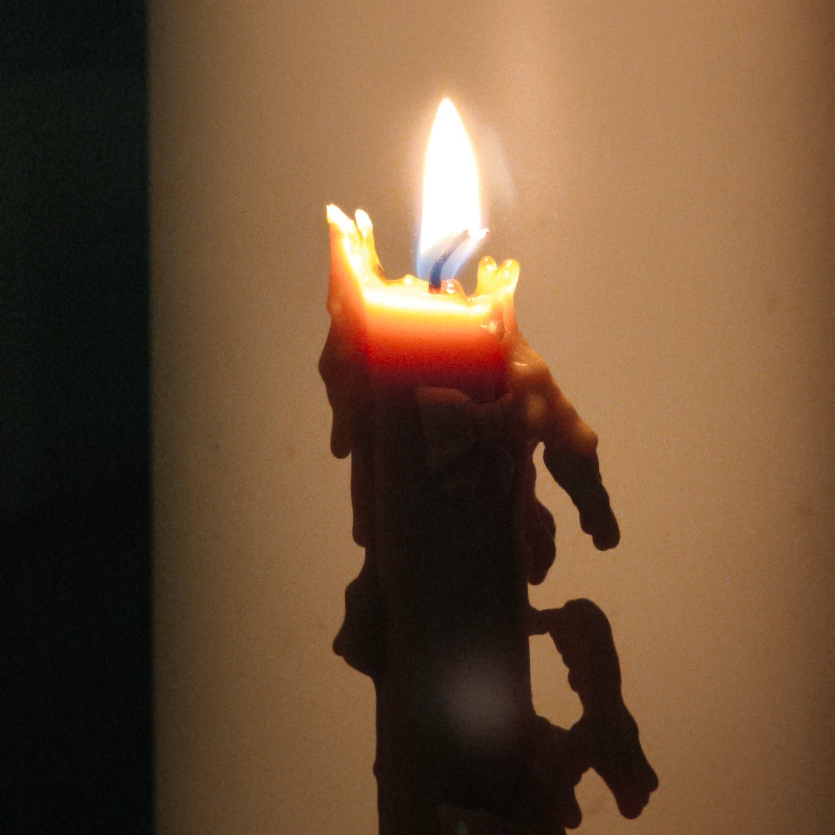 Masked individual documents candle, knife in Belarus apartment