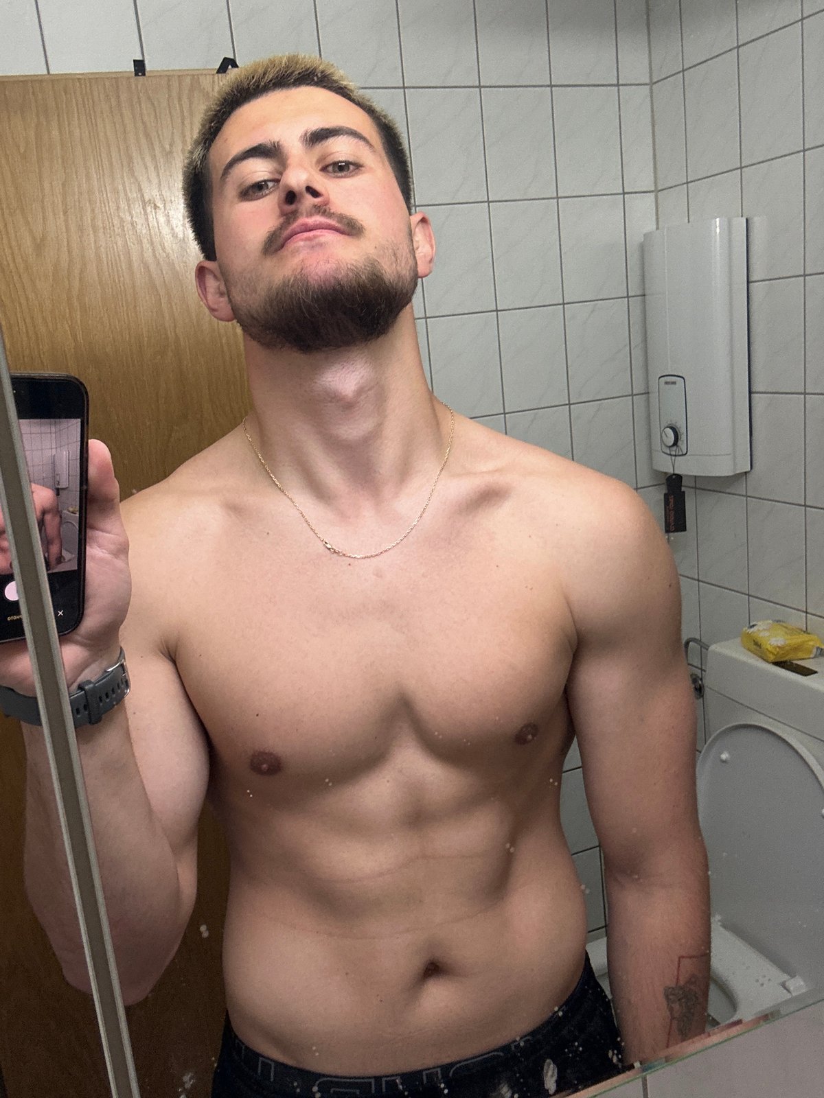 Man takes bathroom mirror selfies in Essen, Germany