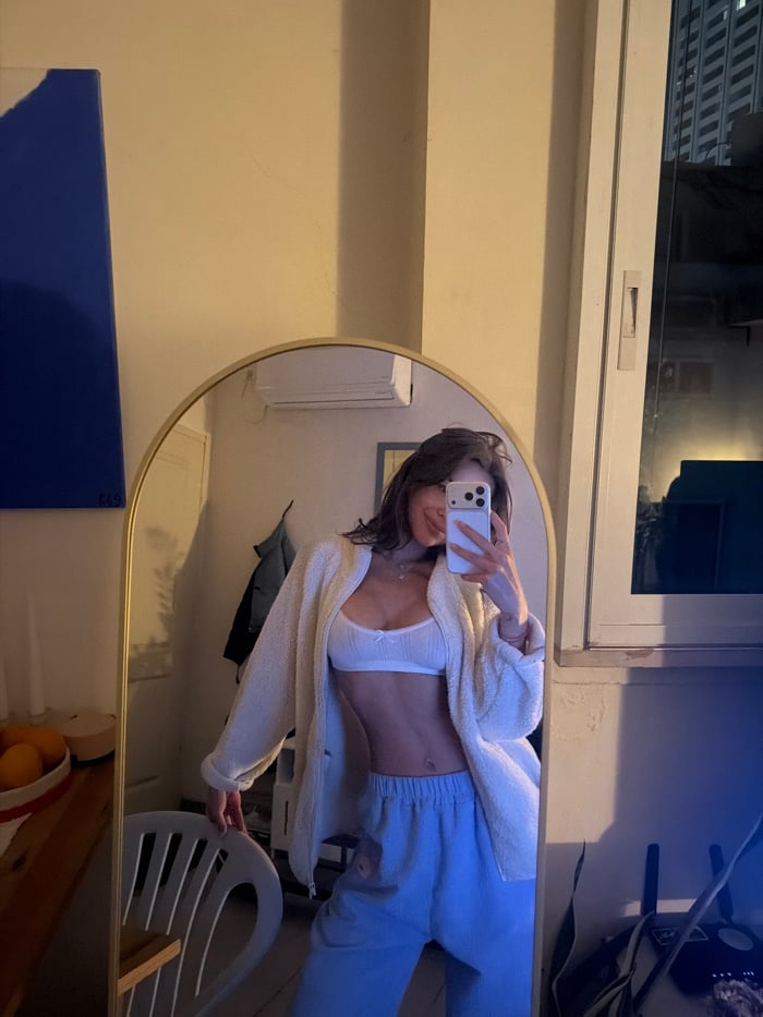 Young woman photographed at multiple indoor Tel Aviv locations