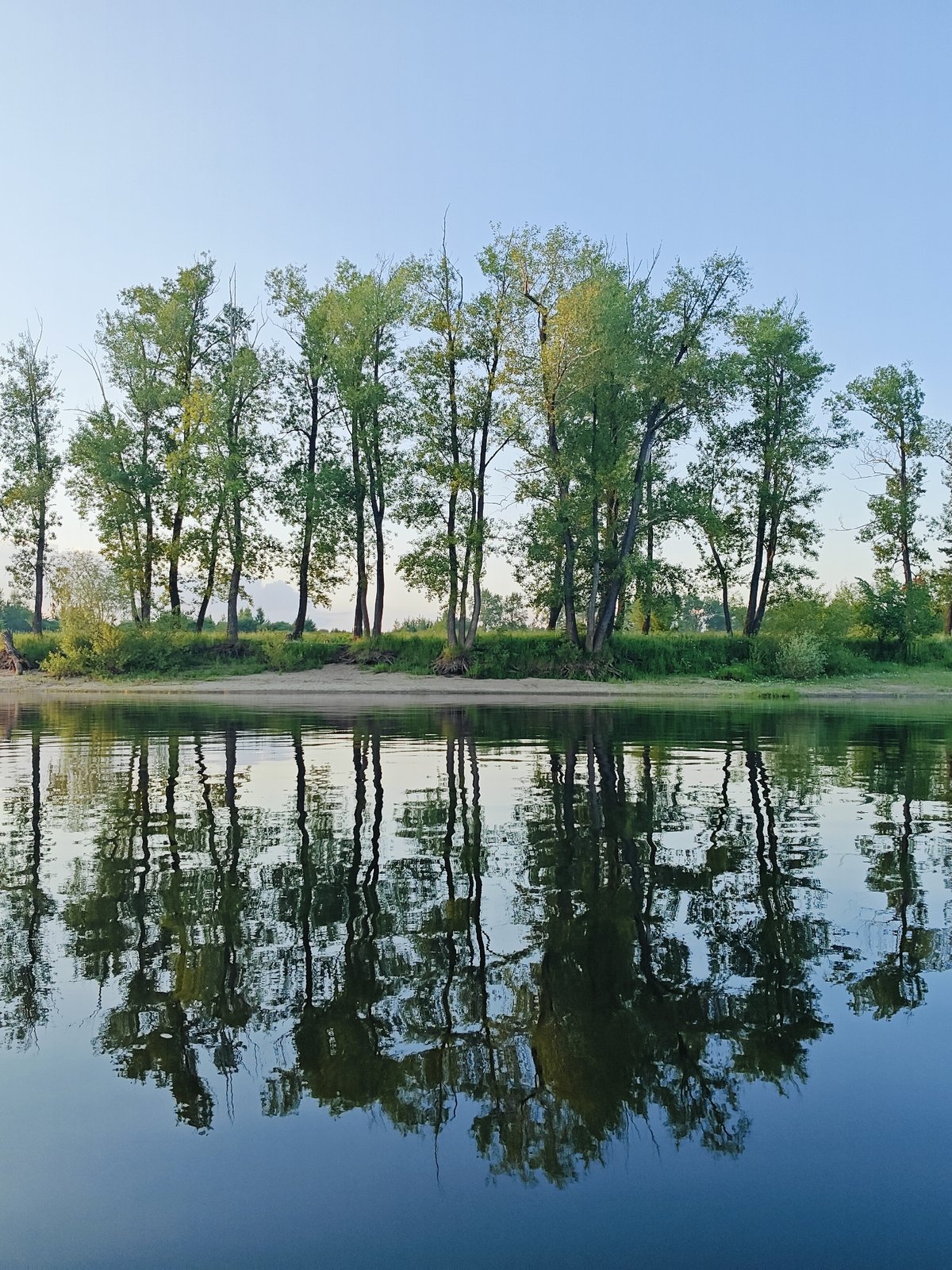 Fishing from an inflatable boat at sunset, Ol'khovskoye