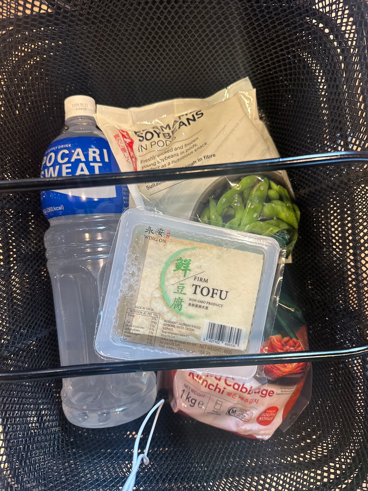 Shopper browses Asian snacks at London supermarket Sunday afternoon