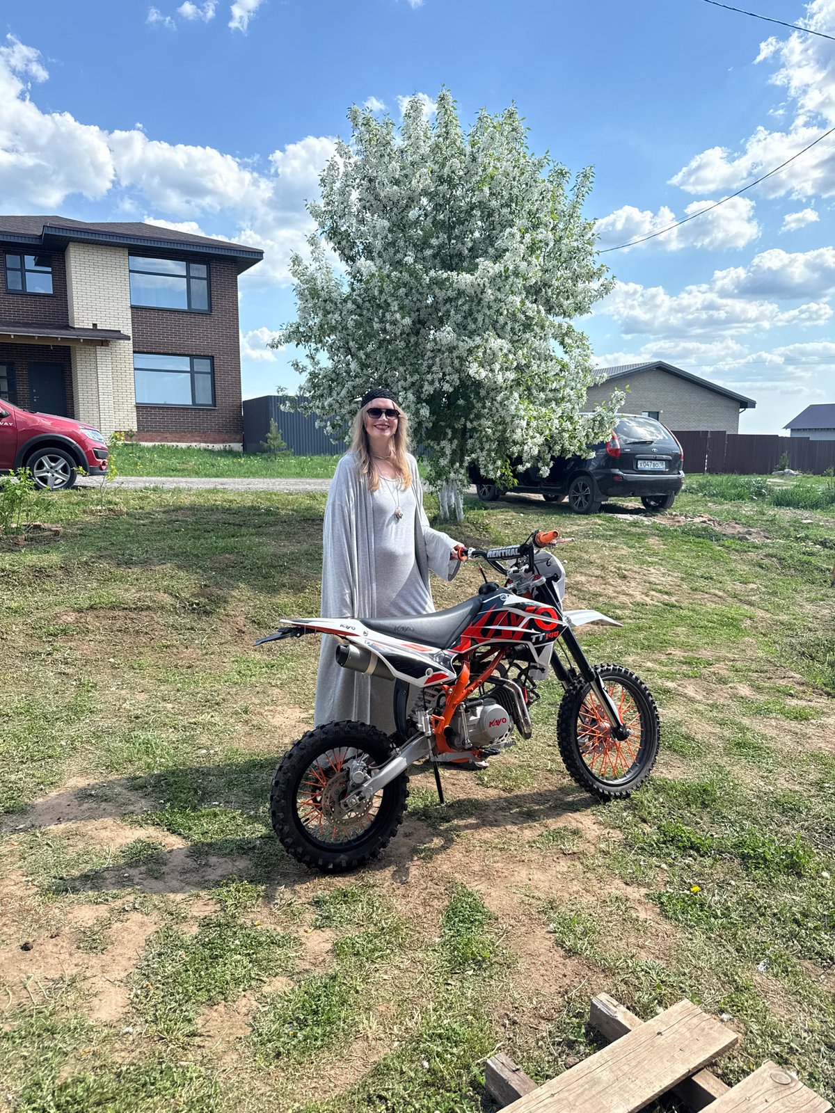 Two people pose with dirt bike in Izhevsk