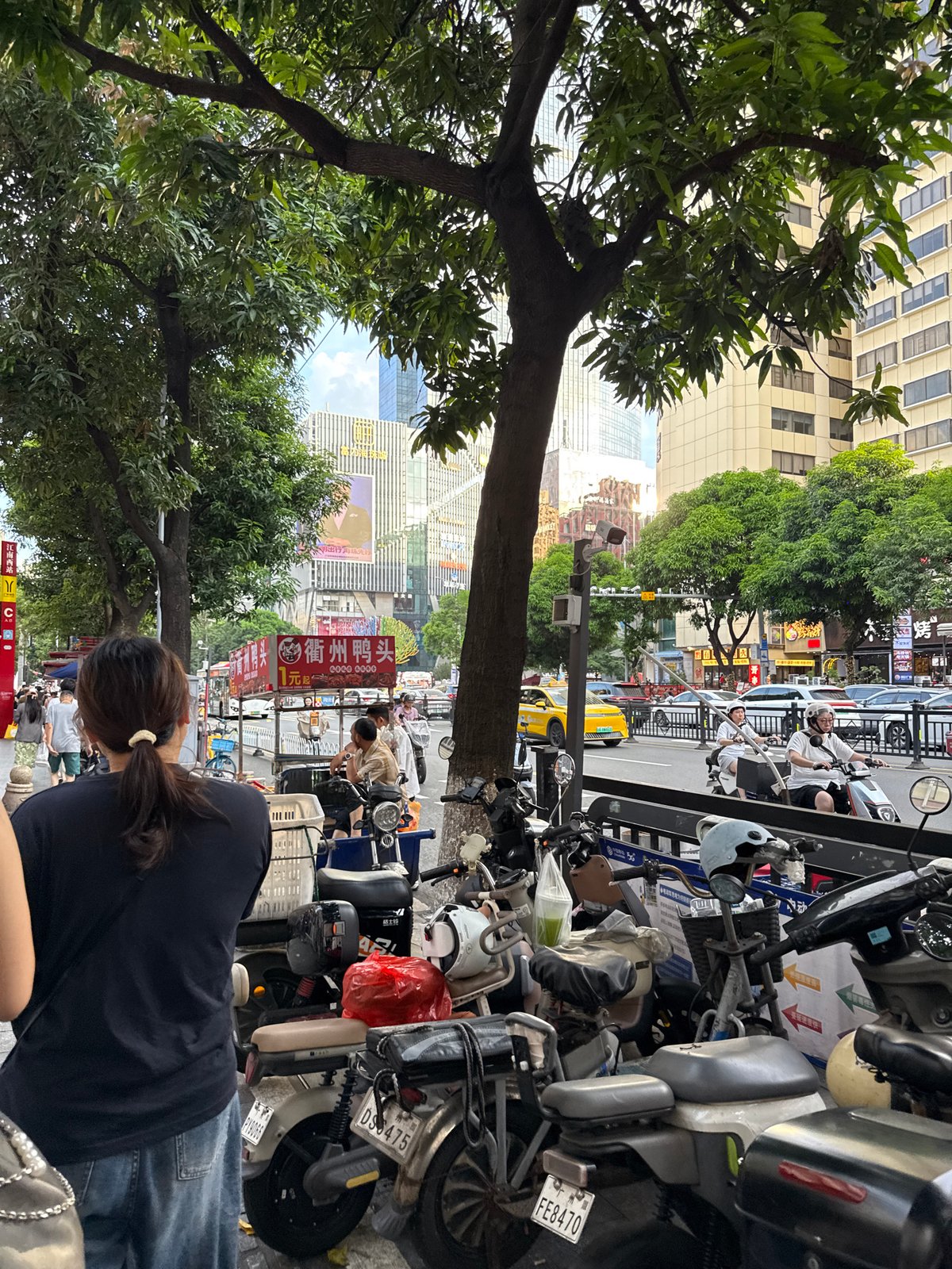 Street market bustle and subway commuting in Haizhu District