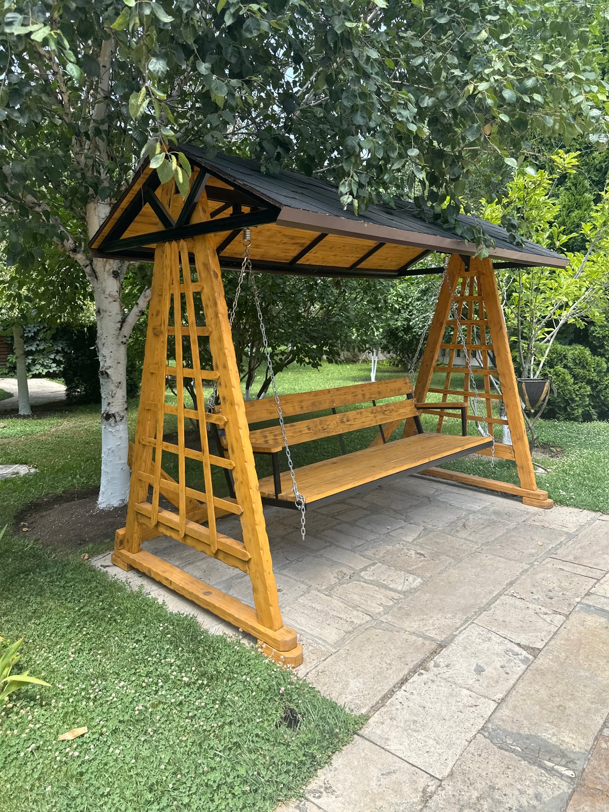 Lush garden scenes: whitewashed trees, swing set, and lily pond