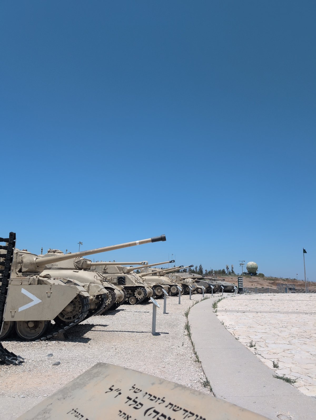 Tan military tanks on display at an outdoor lot, Palestinian Territories