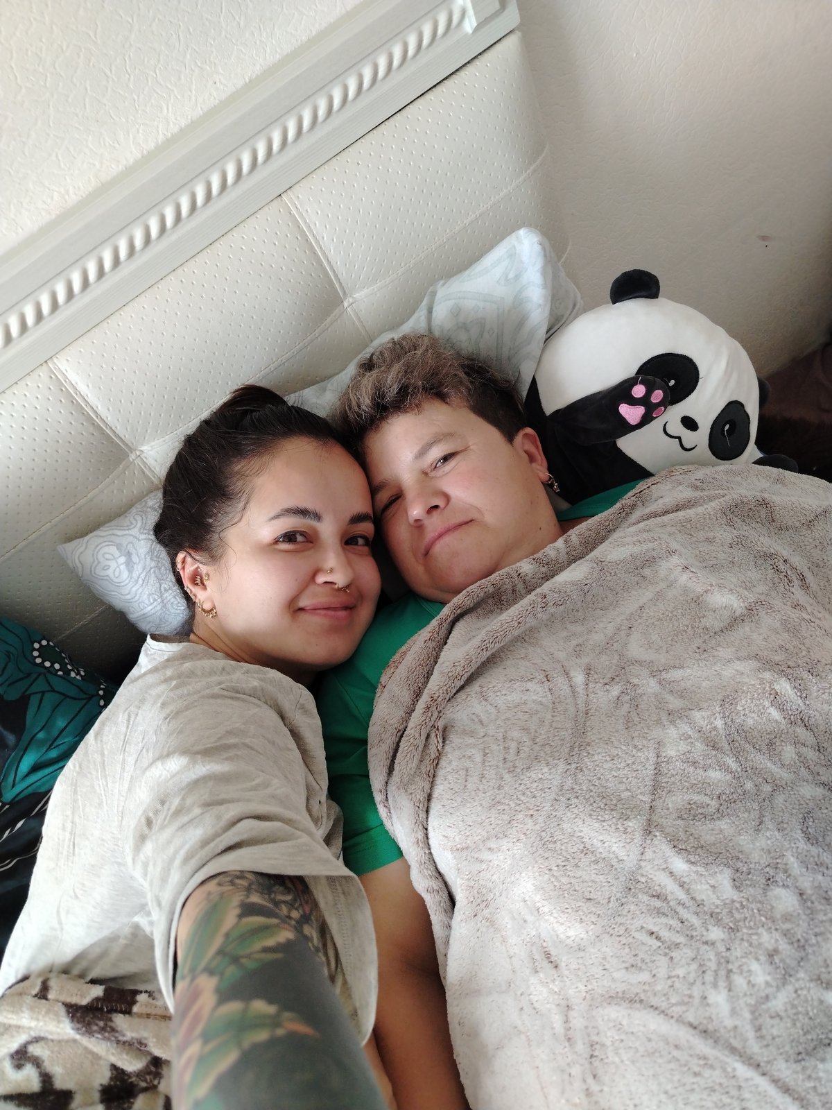 Lazy morning in bed with a pink orchid nearby