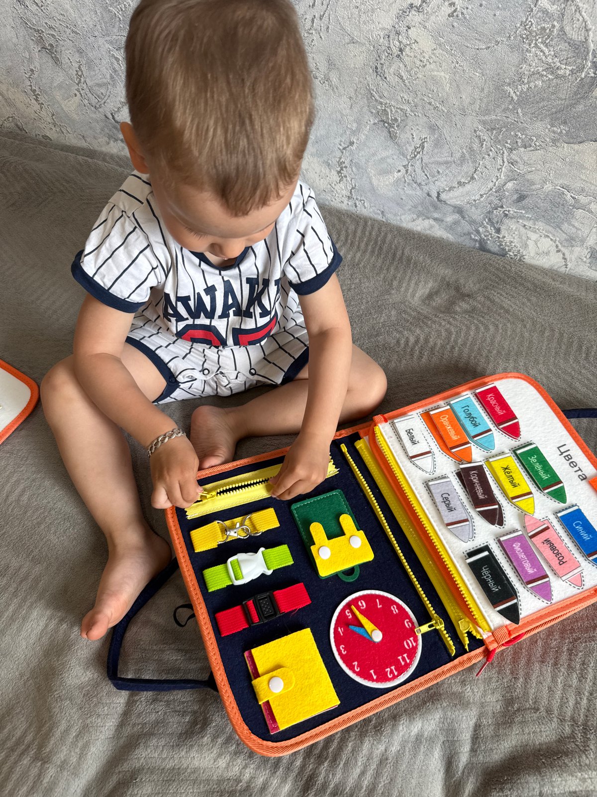 Child plays with educational toys during early morning in Russia