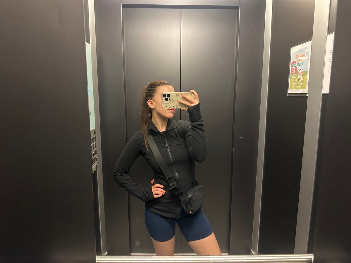 Woman takes elevator mirror selfie in Huixquilucan, Mexico