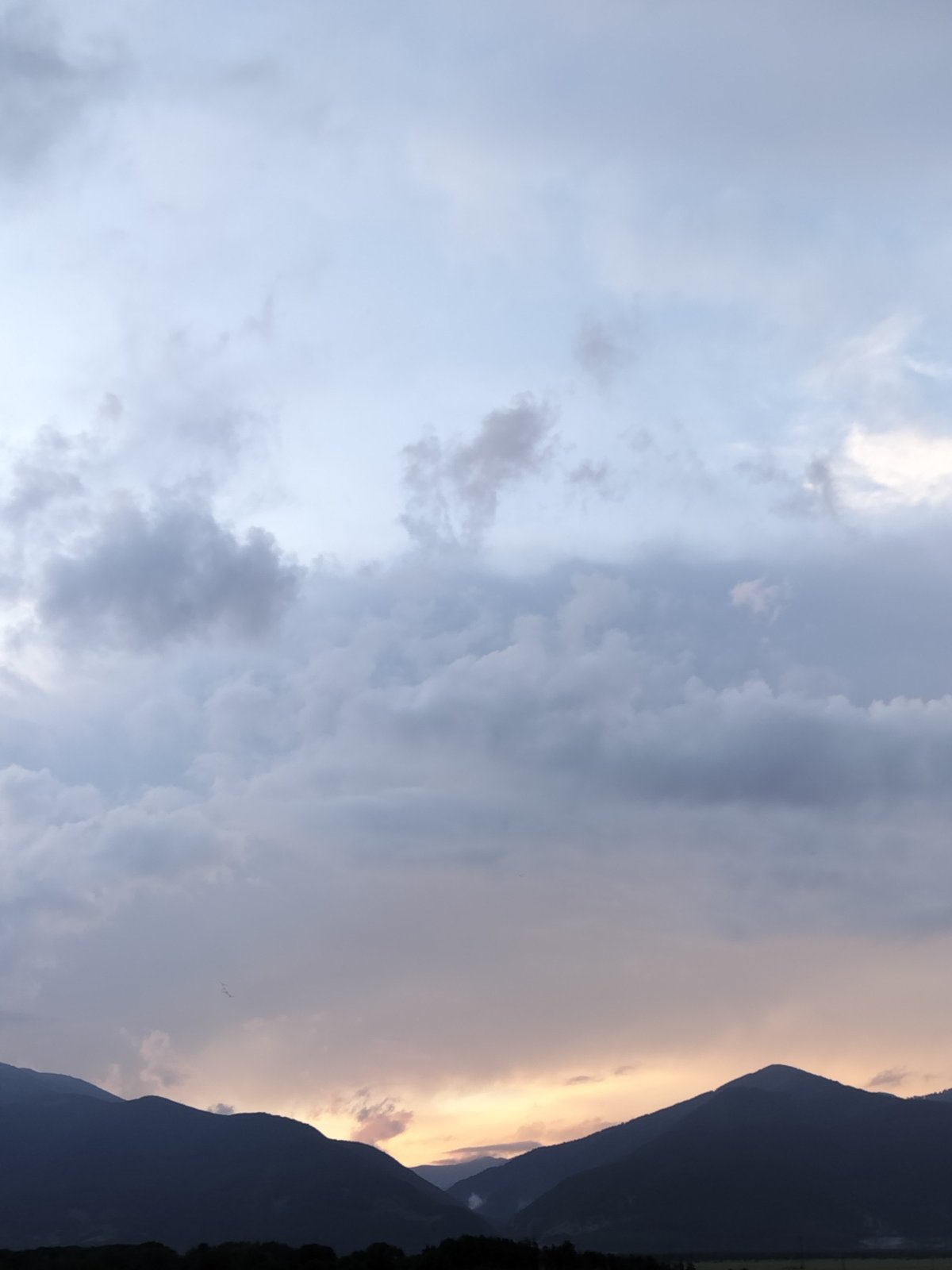 Dramatic skies documented over Bulgarian mountains during evening hour