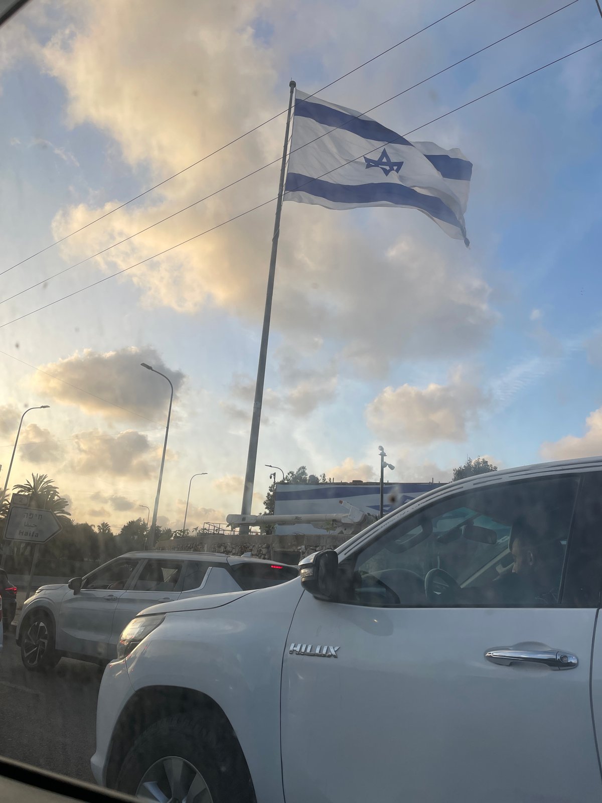 Israeli flag observed on busy street in Herzliya area