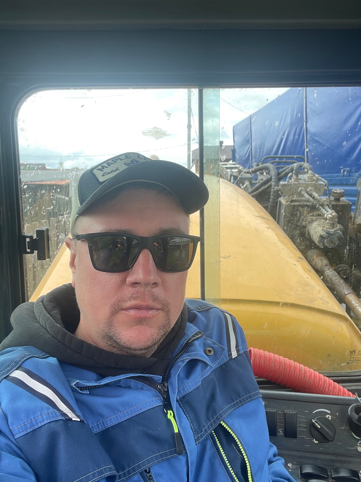 Construction worker operates heavy machinery in Железнодорожный, Russia