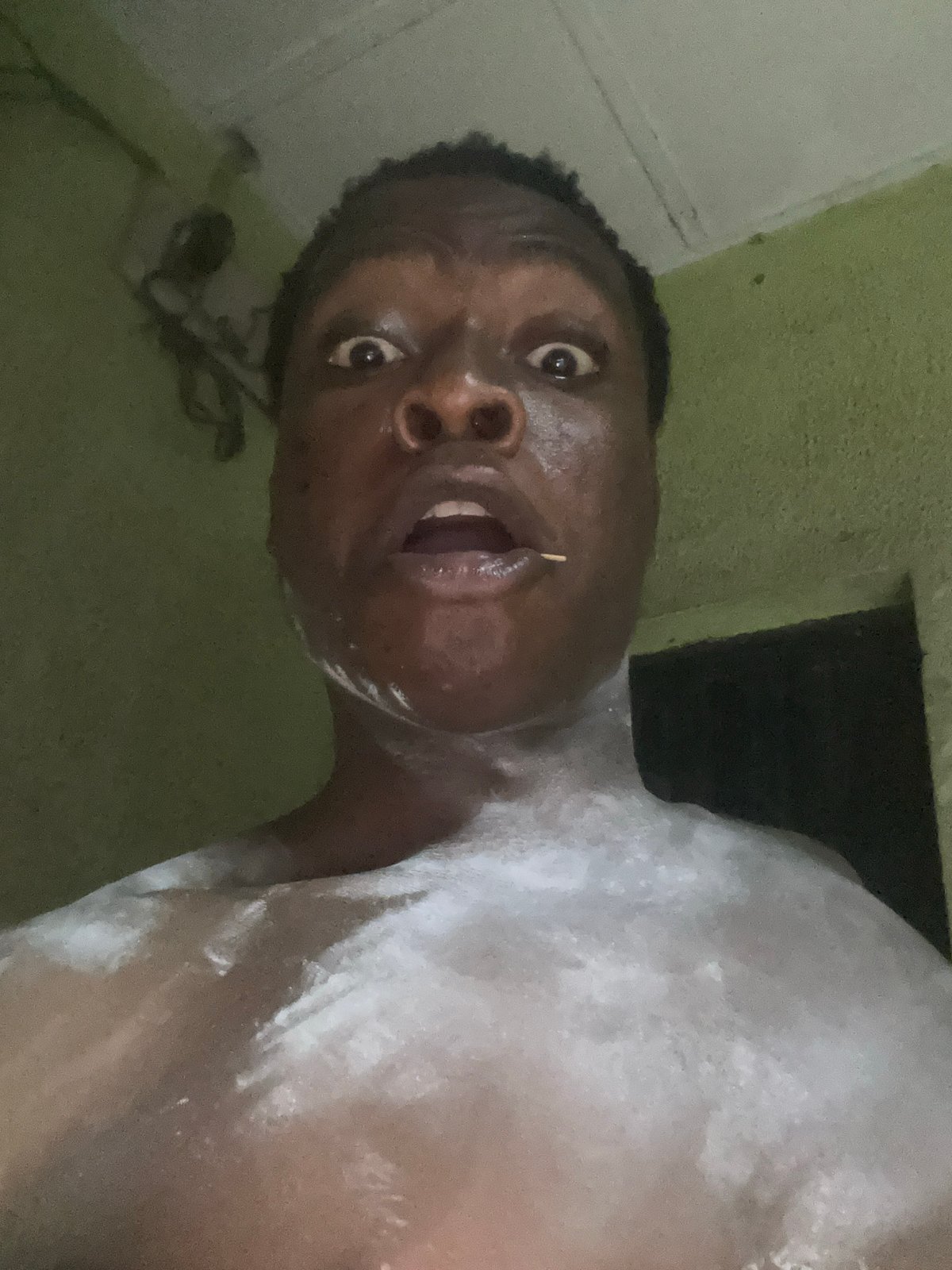 Person photographed with white substance at unknown location