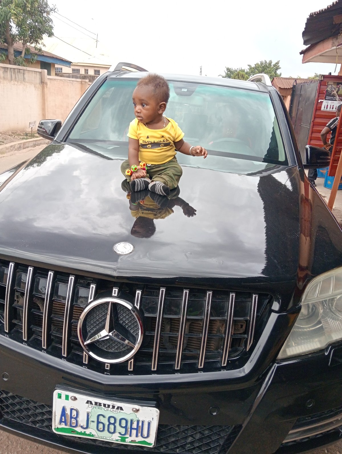 Everyday family moments captured across Jos, Nigeria neighborhoods