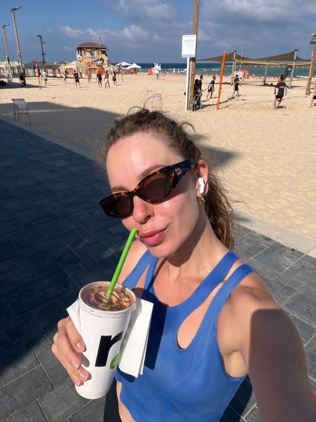 Early morning at Tel Aviv beach: volleyball, sea views, and coffee