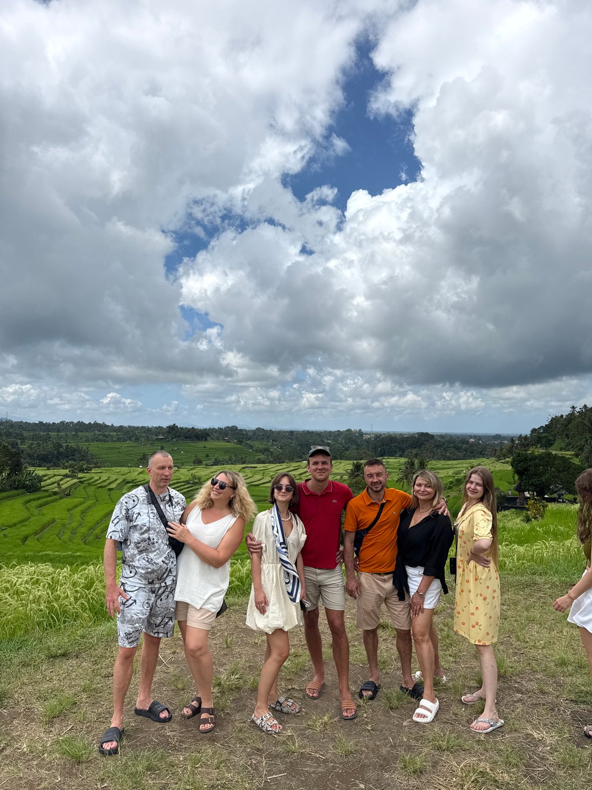 Seven people pose for photo amid rice terraces in Penebel