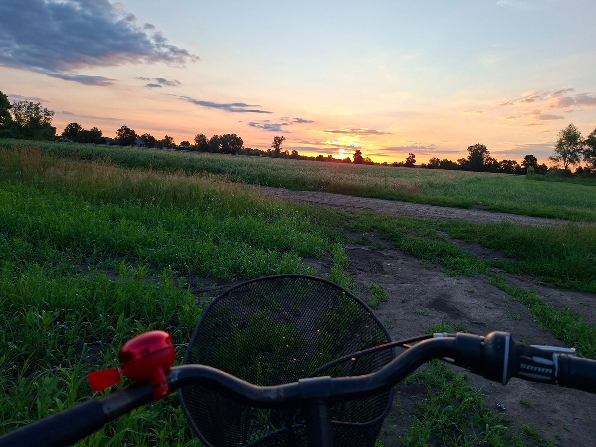 Evening bike ride through rural fields, fishing spot included