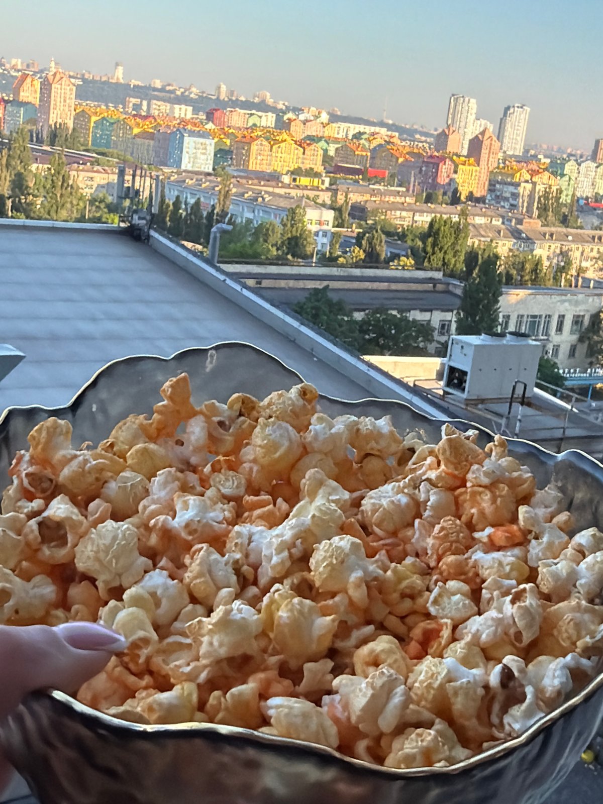 Rooftop morning in Kyiv with city views and quiet downtime
