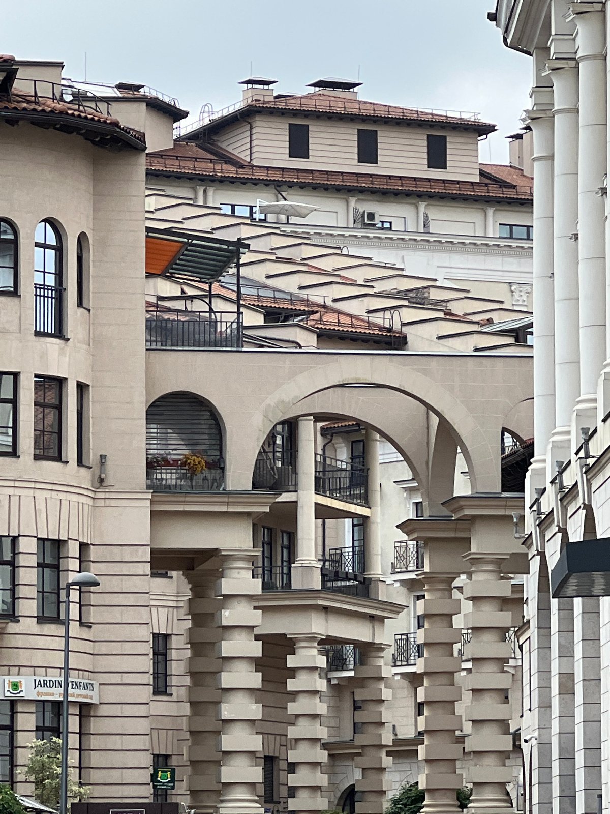 Moscow street and classical-style building complex, overcast day