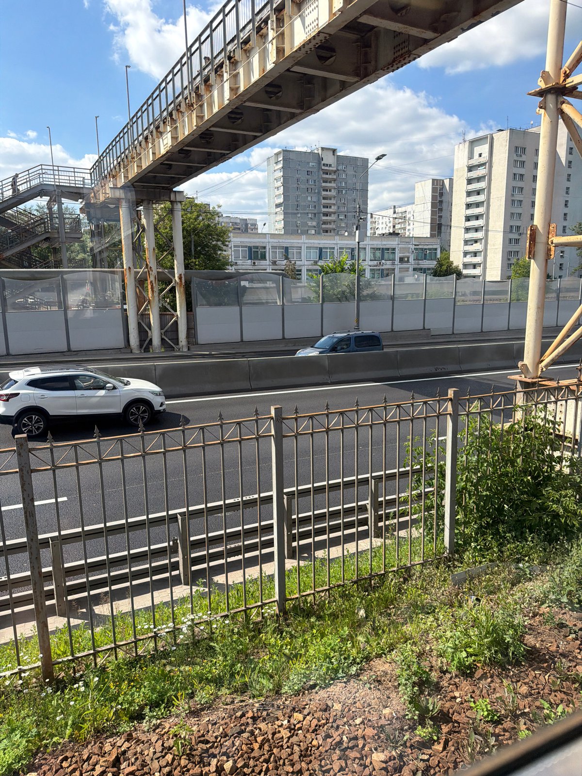 Street-level and aerial views of a Moscow road on a sunny day