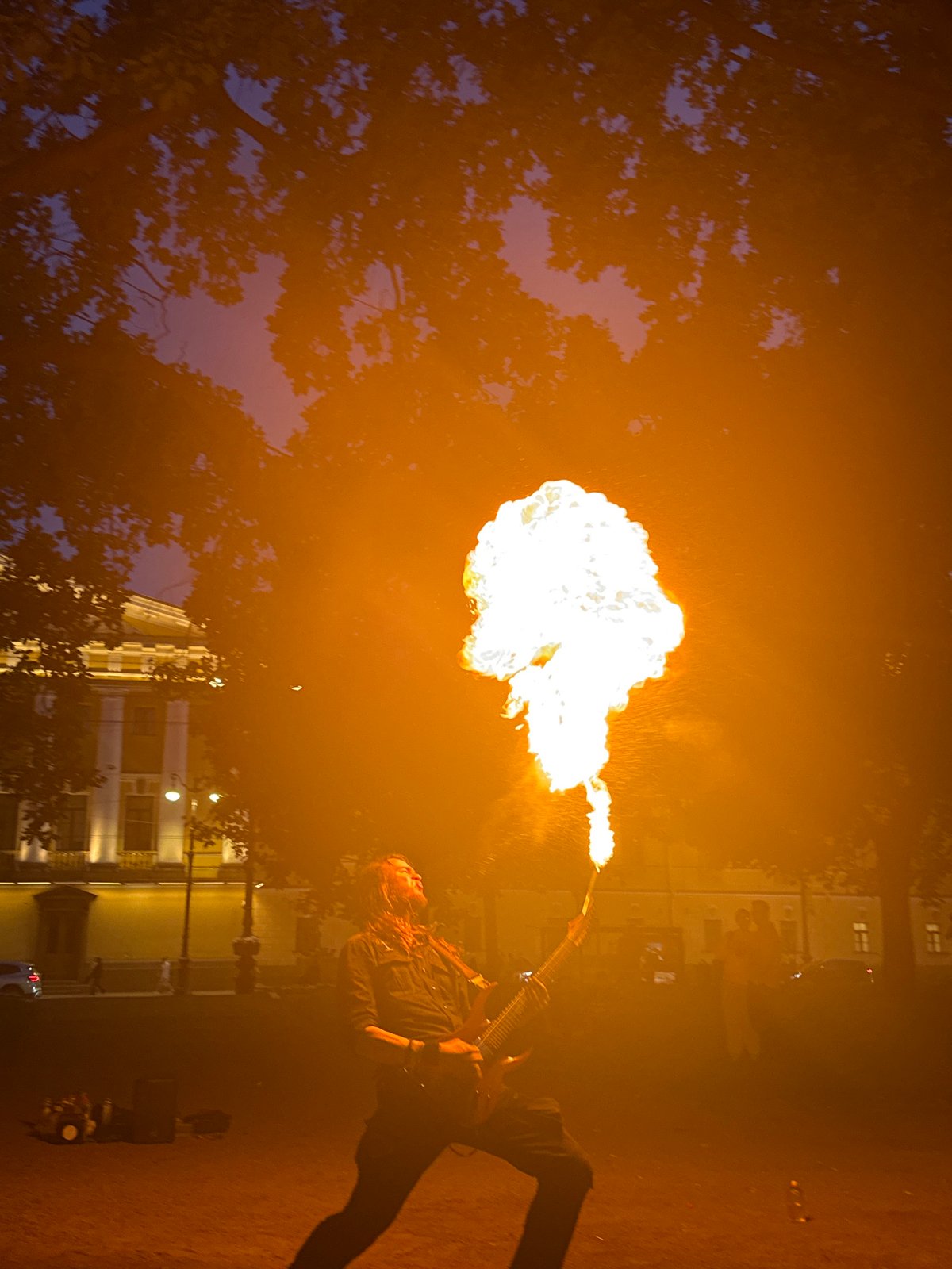 Fire performers demonstrate across Saint Petersburg public squares at twilight