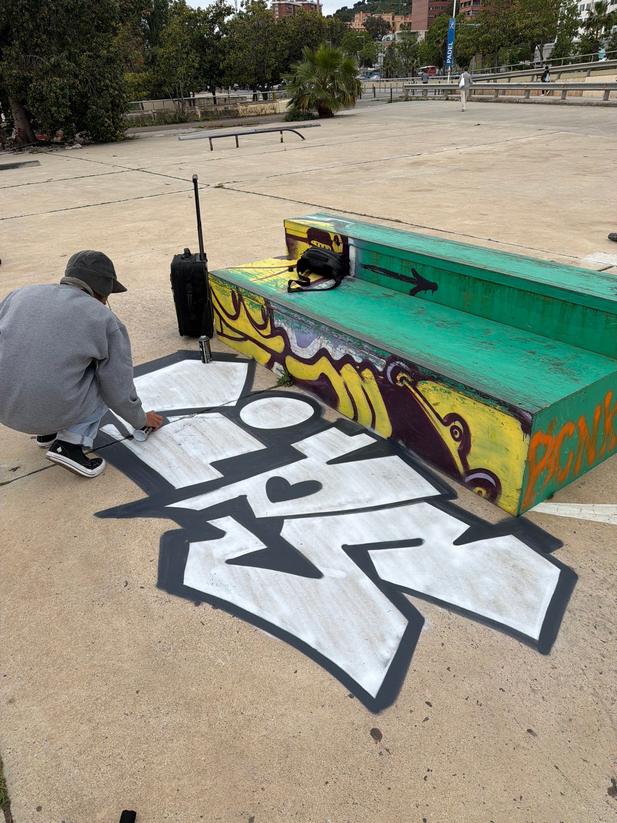 Morning scenes across Barcelona: graffiti, rooftop observer, escalator maintenance
