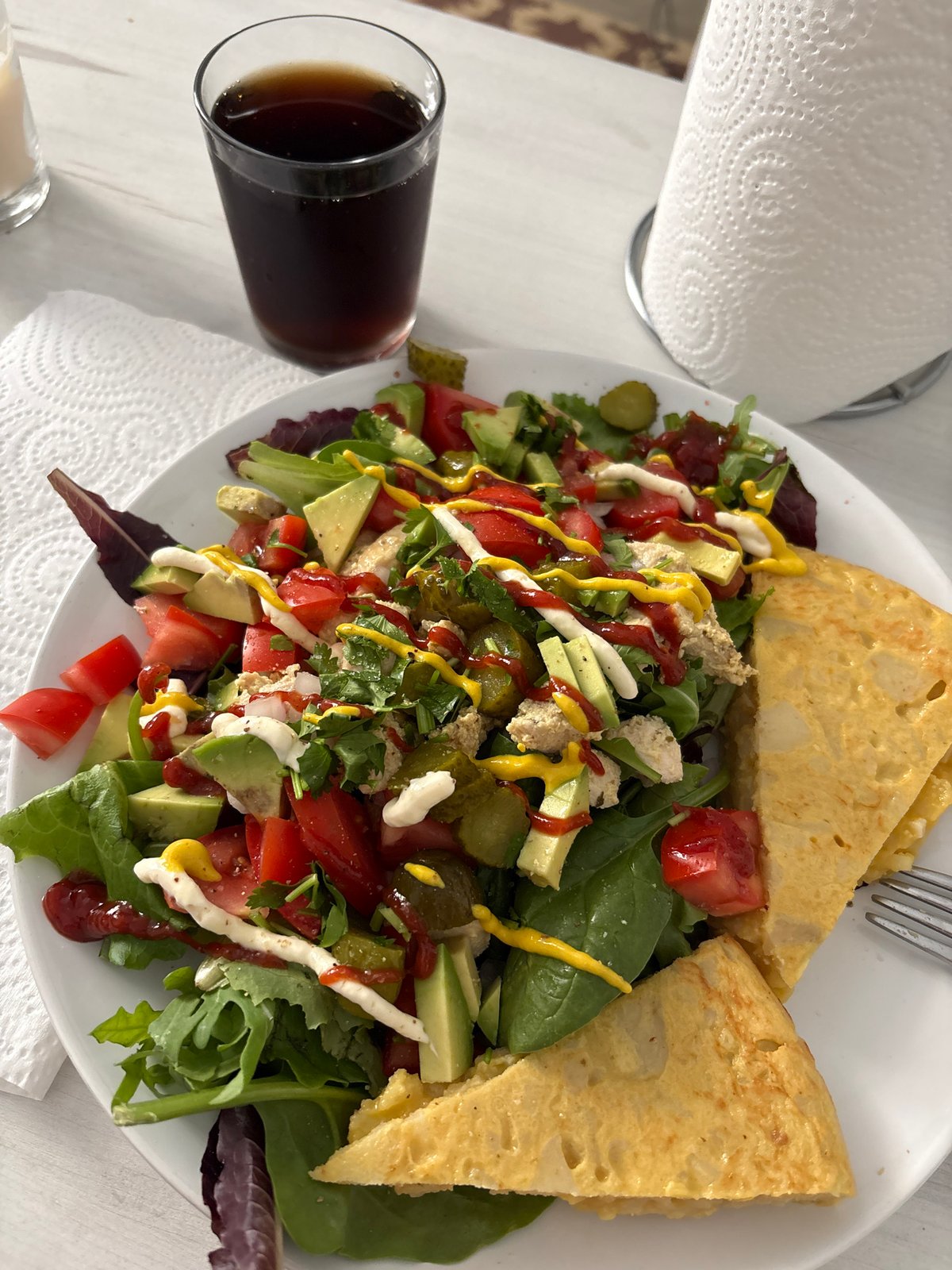 Traditional Spanish tortilla served with fresh salad in Barcelona