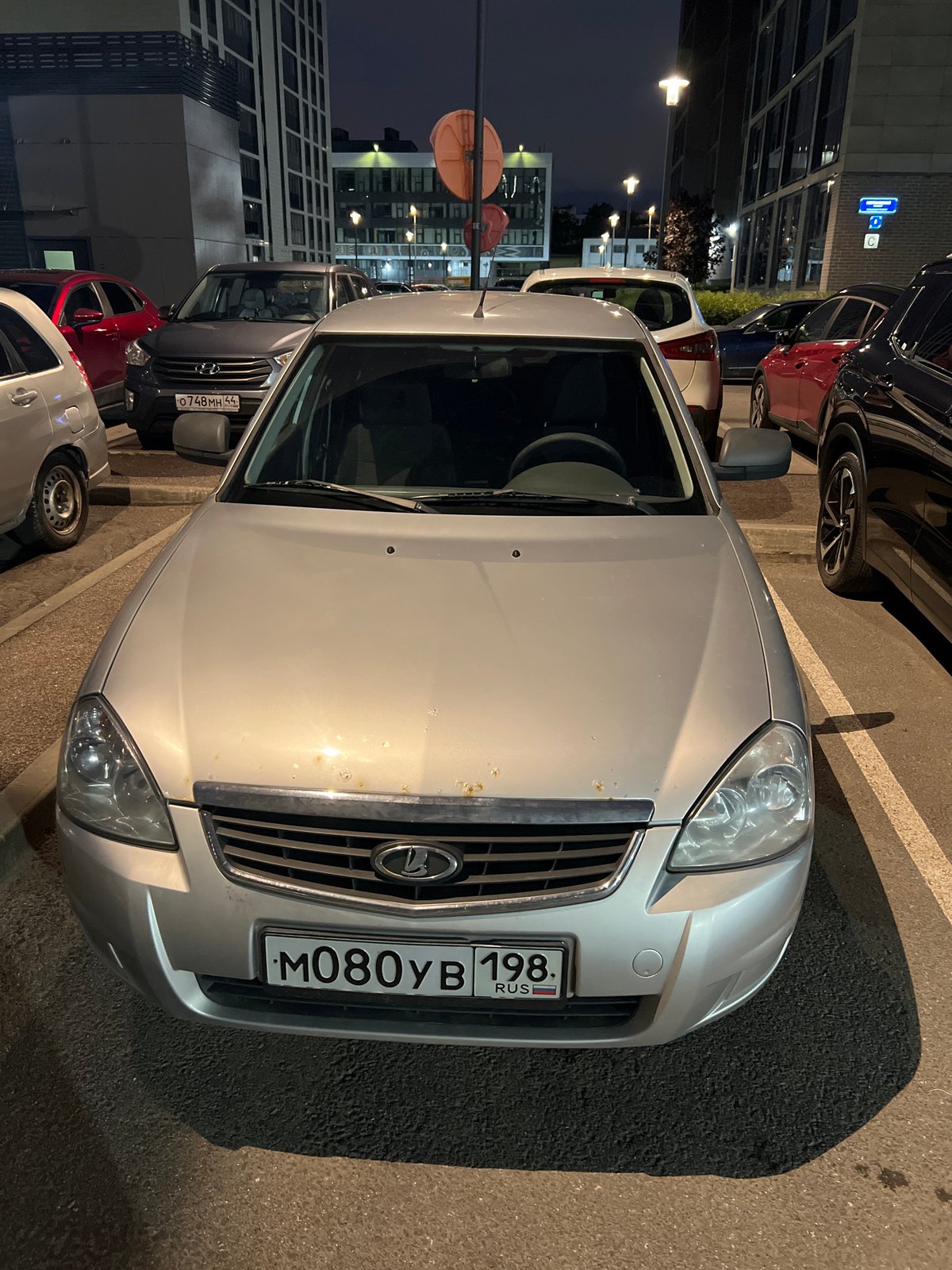Nighttime documentation of vehicles and buildings in Saint Petersburg