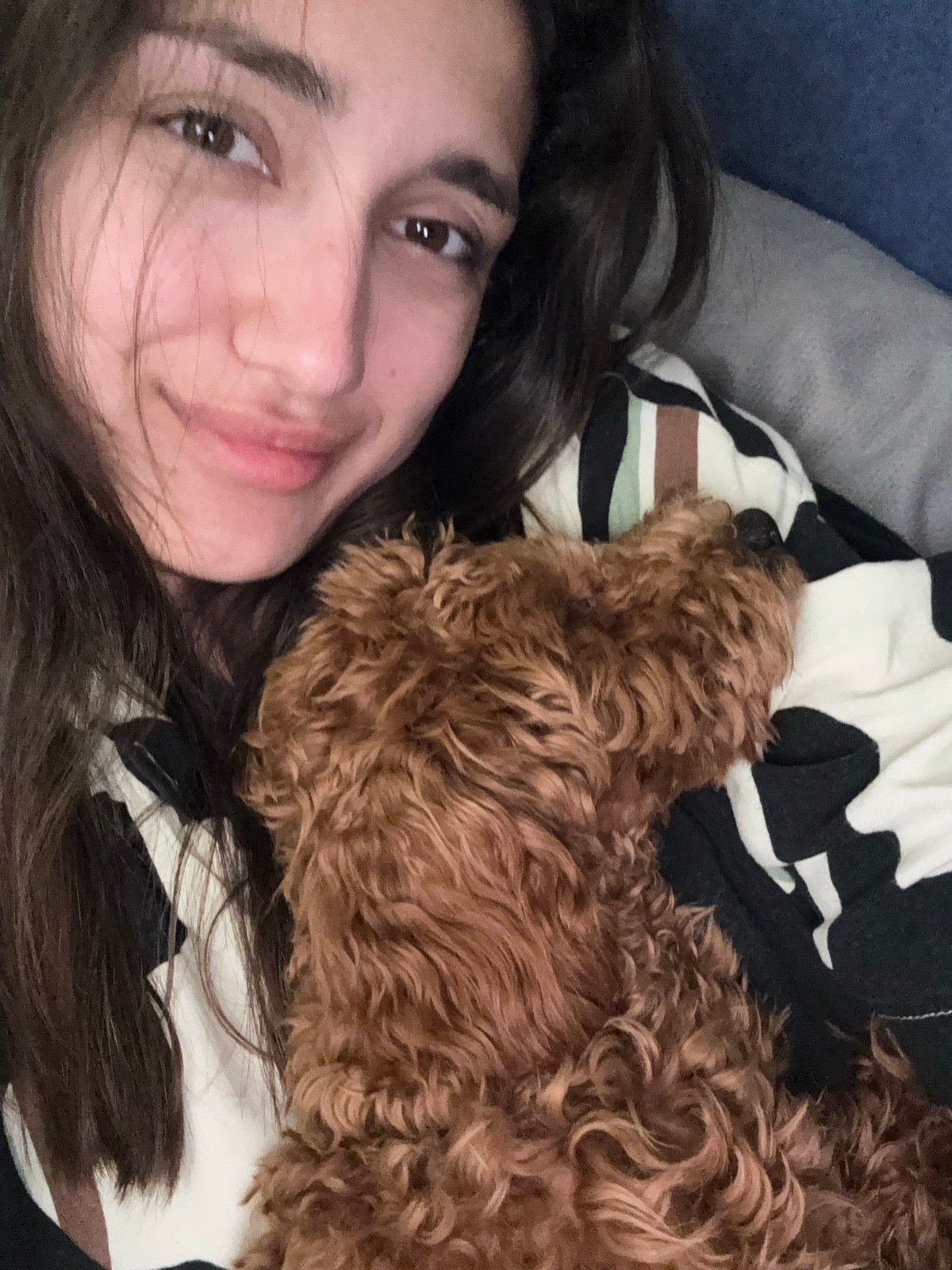 Woman and dog share quiet moment in Montenegro home